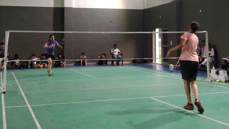 Players showing talent in district level badminton competition