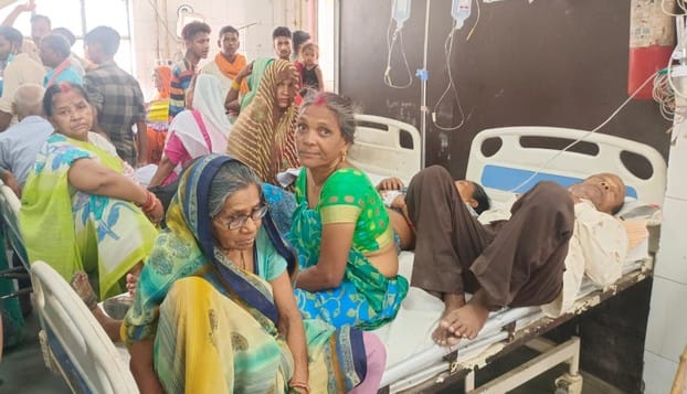 Attack of diseases... two patients on one bed, treated sitting on the ground