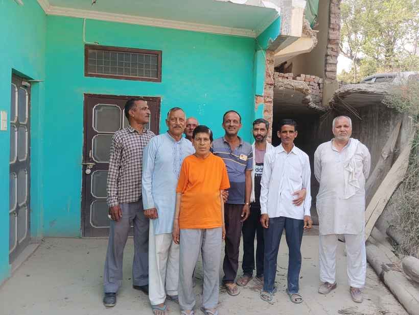 Local villagers protested against the demolition of a soldier's house during highway construction