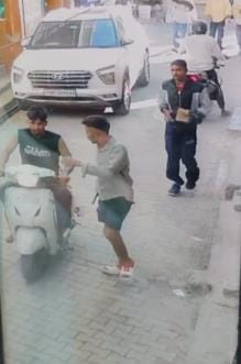 A bullet was fired in a fight between two groups in Lakhnaur village, it hit a mobile shop