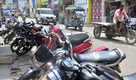 Illegal parking on the footpath, traffic jam in the market