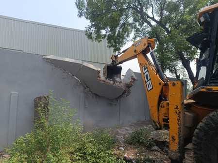 Bulldozer runs on illegal construction near village Masani