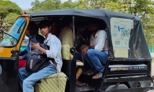 Passengers sitting in an overloaded auto going on Khalilabad-Dhanghata road