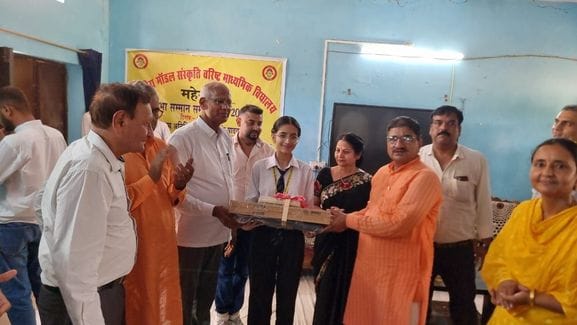 Four meritorious students were honoured with laptops