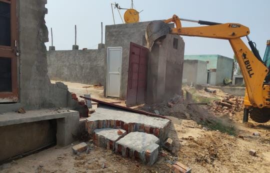 Construction was demolished with the help of JCB in an unapproved colony