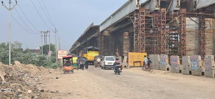 Due to lack of facilities, passengers are forced to wait for vehicles in the scorching afternoon