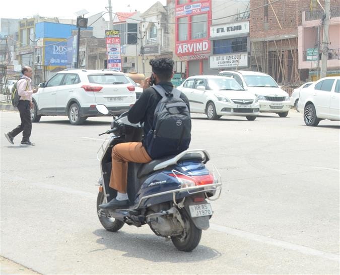 Only two challans were issued in one month for using mobile phone while driving