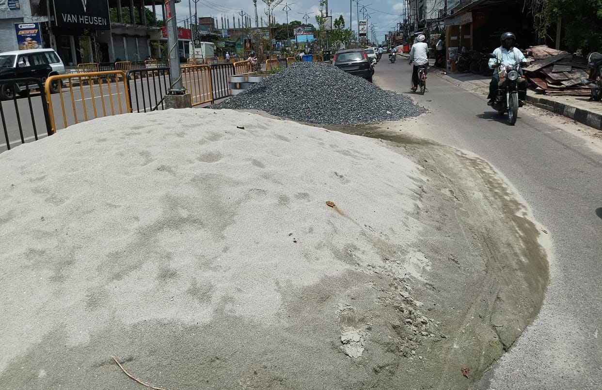 Shopkeepers selling gravel and sand on the road are causing accidents to pedestrians