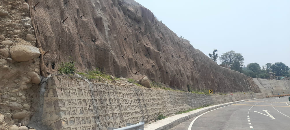 Safety nets and mats are being installed on the hills that come under the four-lane project