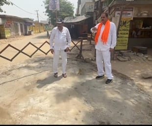 The social worker got the potholes filled with concrete and cement at his own expense