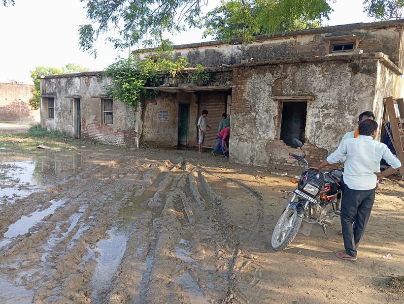Employees sit in the dilapidated building of the cooperative society risking their lives