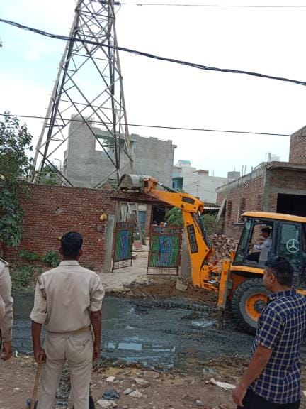 Corporation's bulldozer runs on illegal encroachment