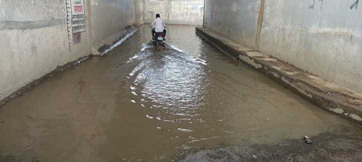 Water filled in the underpass, pedestrians forced to cross the railway track