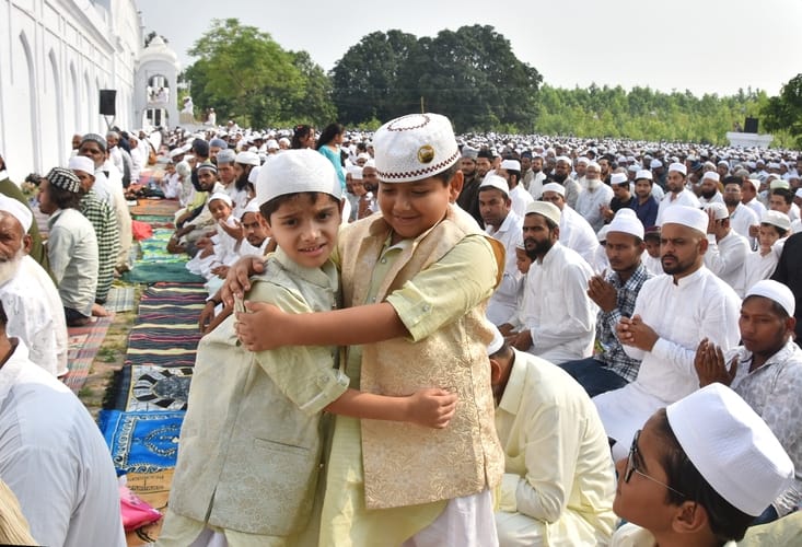 Hugging each other, wishing Eid Mubarak