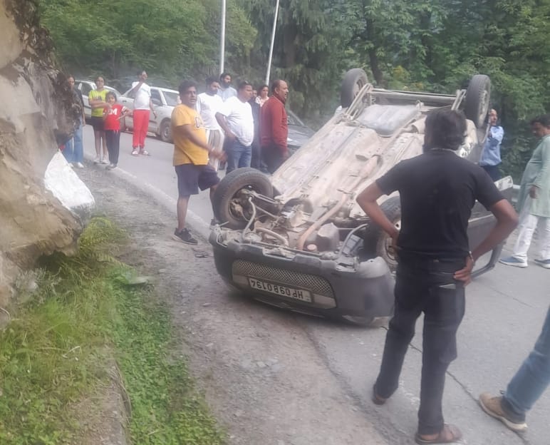 Car overturned near scissors turn