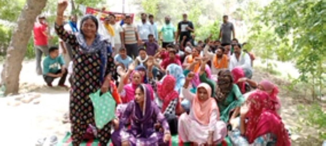 Cleaning workers removed from contract system staged indefinite dharna outside SDM office
