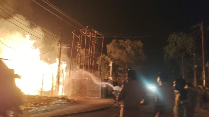 The spark from the transformer set the wooden stack on fire