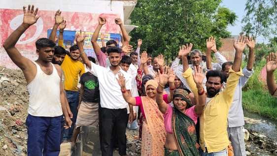 Demonstration held on using substandard material in drain construction and encroachment on road