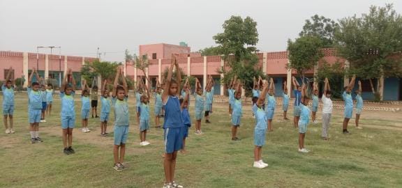 Campers are learning lathi, karate, holistic exercises, sit-ups and yoga