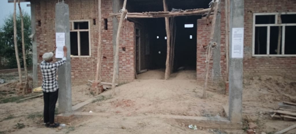 Houses built on the land of Amangarh Reserve Forest