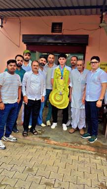 Basketball player Shekhar Rathi welcomed on reaching the village