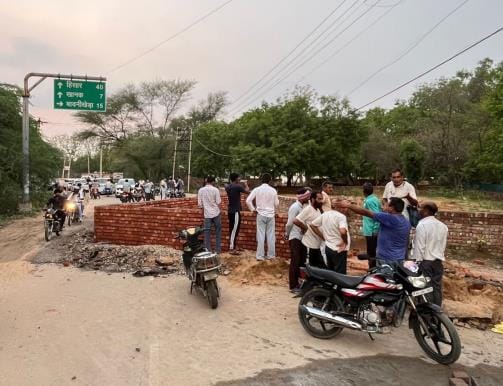 The land was returned to the owner after the Public Works Department's encroachment was removed by the court's order.