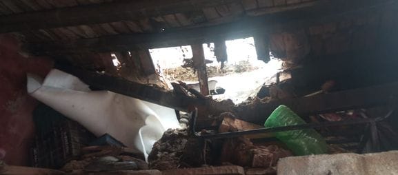 The roof of a BPL family's house collapsed in Tharu village due to rain