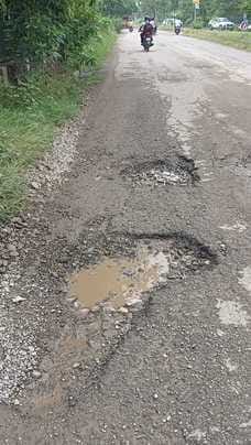 15 potholes from highway to local road