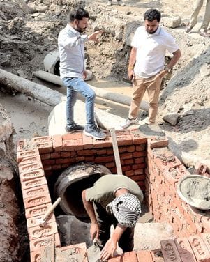 Reprimanded for laxity in laying storm water line