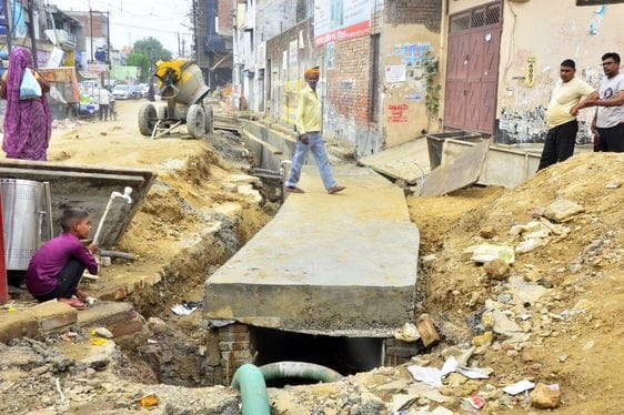 Work of casting slabs in the drain at Lavela Chowk begins