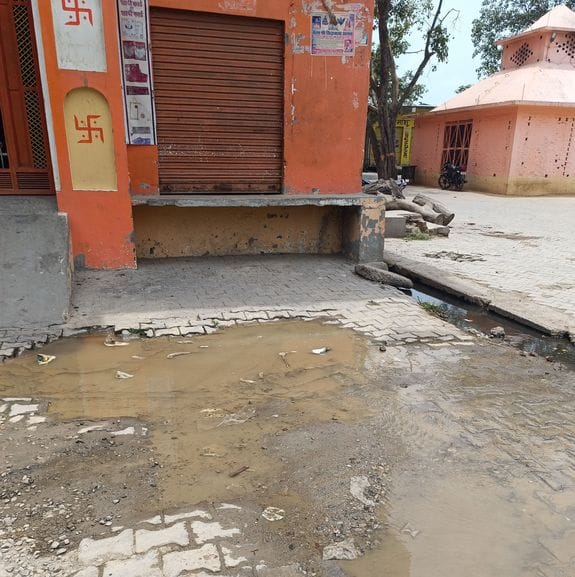 Waterlogging on the way to the temple due to pipe burst
