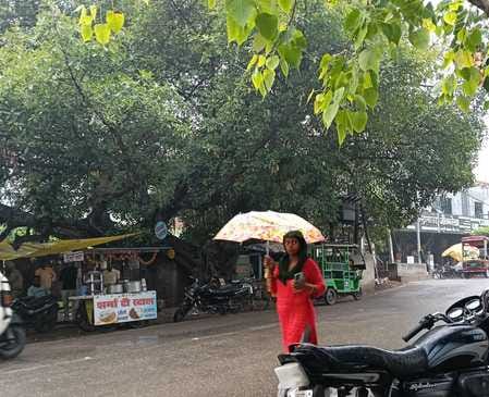 Clouds remained overnight, temperature dropped due to rain in the morning