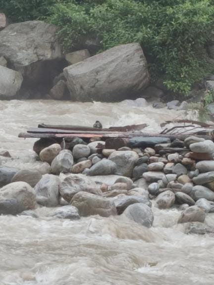 The wooden bridge built on the Pindar river was washed away due to heavy rain