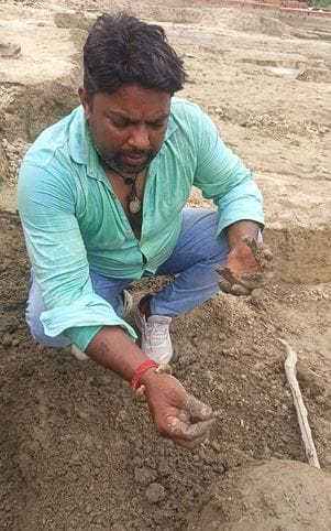 Male skeleton and ancient pots found during digging of a pond in Devar village