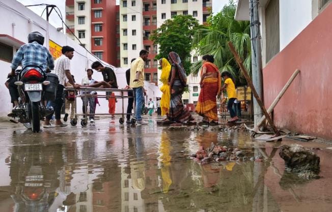 Patients and their relatives walked on bricks to reach the treatment center