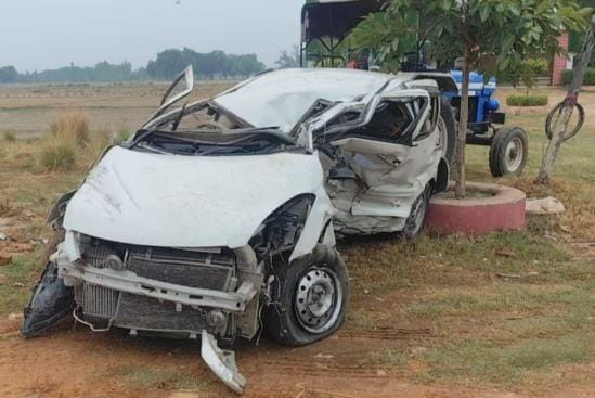 Car collides with container, three injured