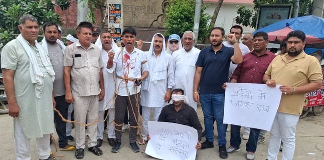 Blood on clothes, protest against deteriorating law and order and corruption