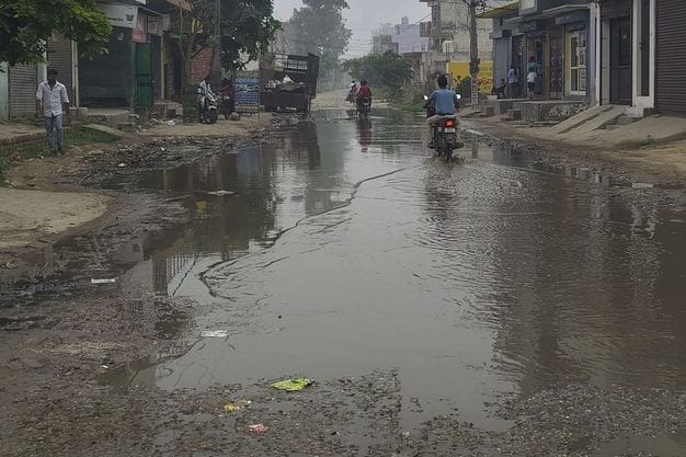 Contaminated water filled on big road, no drainage is taking place