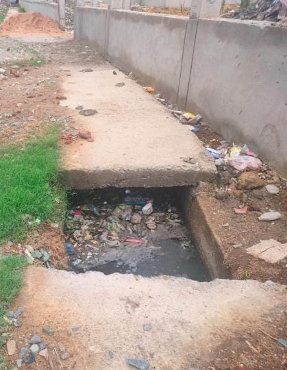 The drain constructed at a cost of Rs. 14.5 crore is choked above the road, water is entering the houses
