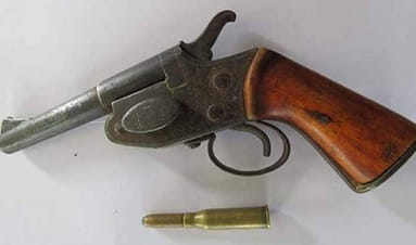 Two Indians arrested with country made pistol and cartridges
