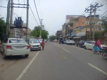 Vehicles occupy the footpath, people are forced to walk on the road, traffic jams are occurring