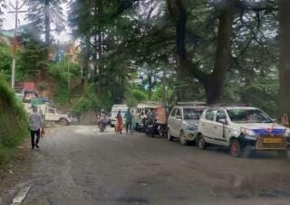 Water flowing on the road due to lack of drain on NH side