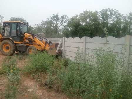 Bulldozer runs on illegal construction
