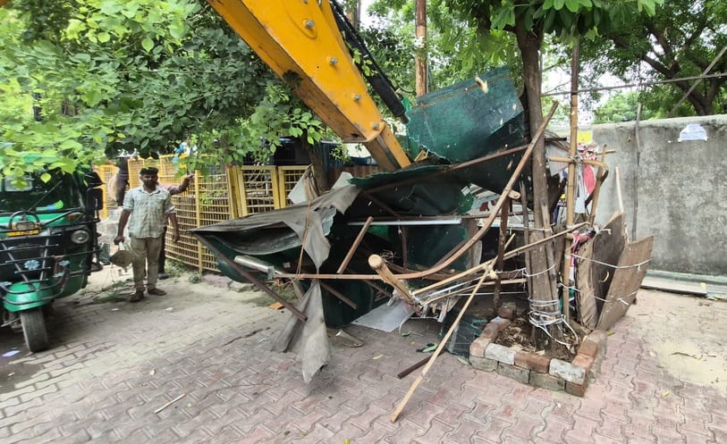 The corporation's bulldozer roared and demolished 70 illegal constructions