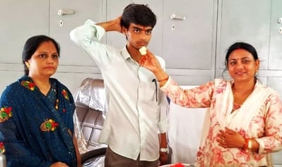 MLA Salona encouraged the topper by feeding him sweets