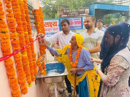 Grandchildren installed a water cooler in memory of their grandfather