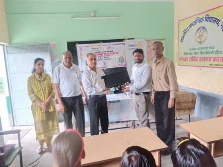 rotary club donate computer set to nehli school
