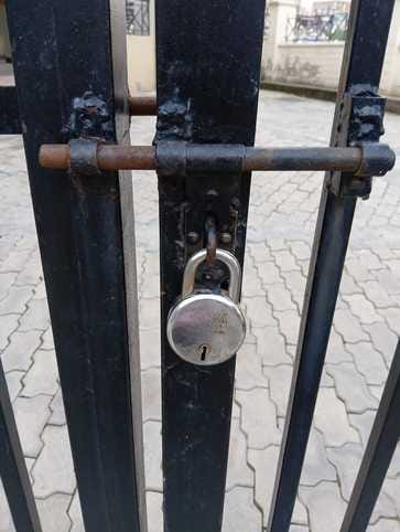Lock hanging on Ayush hospital building at 5:00 in the evening