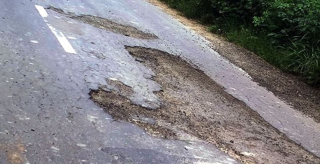 Drivers getting injured after falling on the dilapidated Bhigan-Rajpur road.