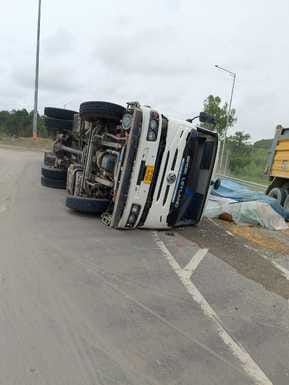 Truck overturns, driver and operator injured